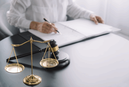 Image is of a lawyer at their desk working on a client's case, concept of what to do after a hit and run motorcycle accident in Nashville