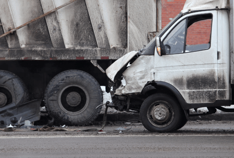 Image is of a white van in an underride accident with a semi-truck, concept of underride accidents in Nashville