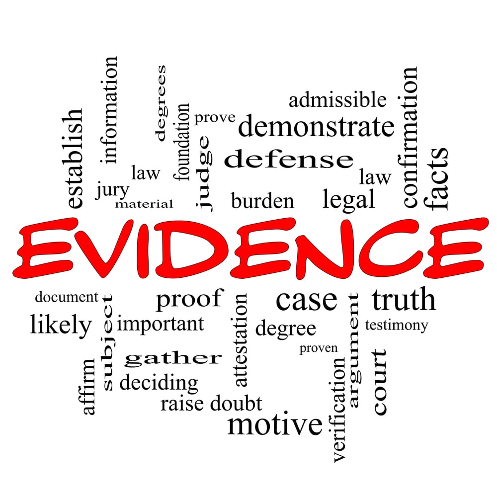 Image is of the word evidence surrounded by legal terms, concept of fault in truck accidents and how proof is evaluated in court cases.