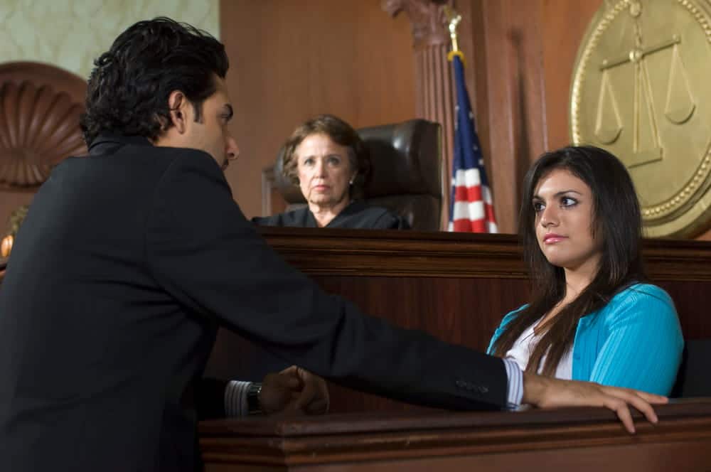 Image is of an attorney questioning a witness during courtroom testimony, concept of a car accident trial and legal proceedings in Nashville.