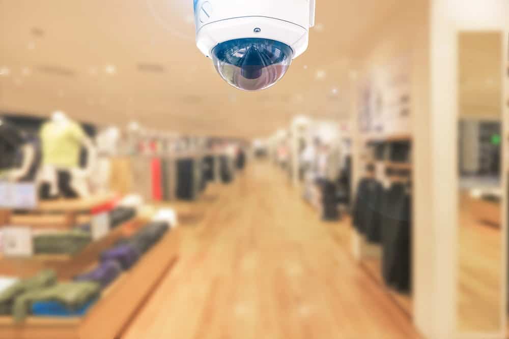 Image is of a security camera monitoring a retail store, concept of surveillance footage preserving evidence for a slip and fall claim.