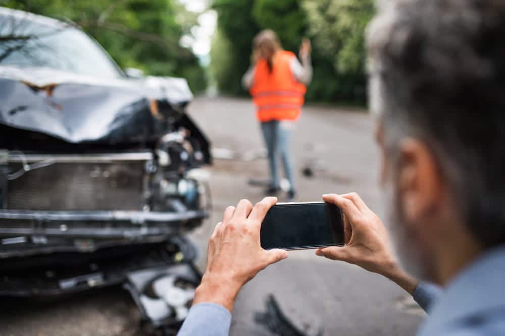 Image is of a driver's view approaching a pedestrian crossing before a rideshare car accident in Nashville, concept of staying alert to prevent collisions.
