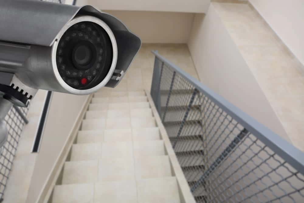 Image is of a surveillance camera overlooking stairs, concept of video evidence in a slip and fall claim.